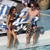 Tom Felton et Jade Olivia, au bord d'une piscine à Miami (Floride), le vendredi 30 décembre 2011.