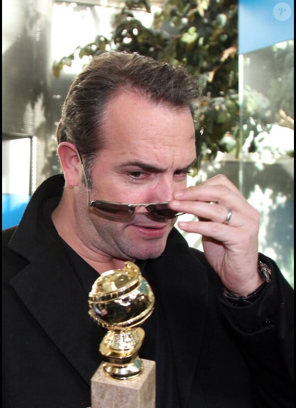 Jean Dujardin à l'aéroport de Roissy-Charles-de-Gaulle, revenant de Los Angeles, le 17 janvier 2012