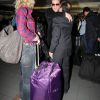 Jean Dujardin et sa femme chérie Alexandra Lamy à l'aéroport de LA en route pour Paris, fous de joie et de bonheur.