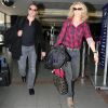 Jean Dujardin et sa femme chérie Alexandra Lamy à l'aéroport de LA en route pour Paris, fous de joie et de bonheur.