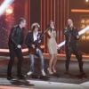 Les quatre coachs de The Voice, Jenifer, Garou, Florent Pagny et Louis Bertignac chantent Rolling in the Deep dans The Voice, samedi 25 février sur TF1