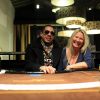JoeyStarr et Frédérique Ruggieri, PDG de la Socodem, célèbrent l'anniversaire du site de poker en ligne MyPok le 10 mars 2012 au cercle Cadet à Paris 