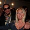 JoeyStarr et Frédérique Ruggieri, PDG de la Socodem, célèbrent l'anniversaire du site de poker en ligne MyPok le 10 mars 2012 au cercle Cadet à Paris 