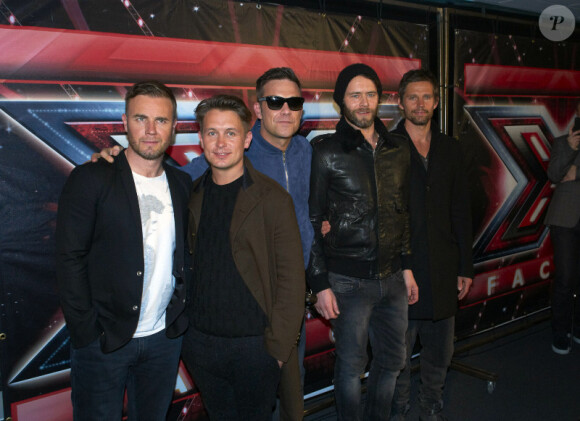 Le groupe Take That et Robbie Williams, ex-membre, au Danemark, en mars 2011.
