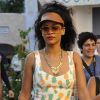 Rihanna en pleine séance shopping à Porto Cervo, porte une visière Fleet Ilya, une combinaison Topshop et des sandales Prada. Le 17 juillet 2012.