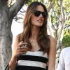 Alessandra Ambrosio, shoppeuse sexy à Los Angeles, habillée d'un débardeur rayé noir et blanc, d'un mini-short noir, d'un sac Céline et de bottines rouges cloutées. Le 19 juillet 2012.