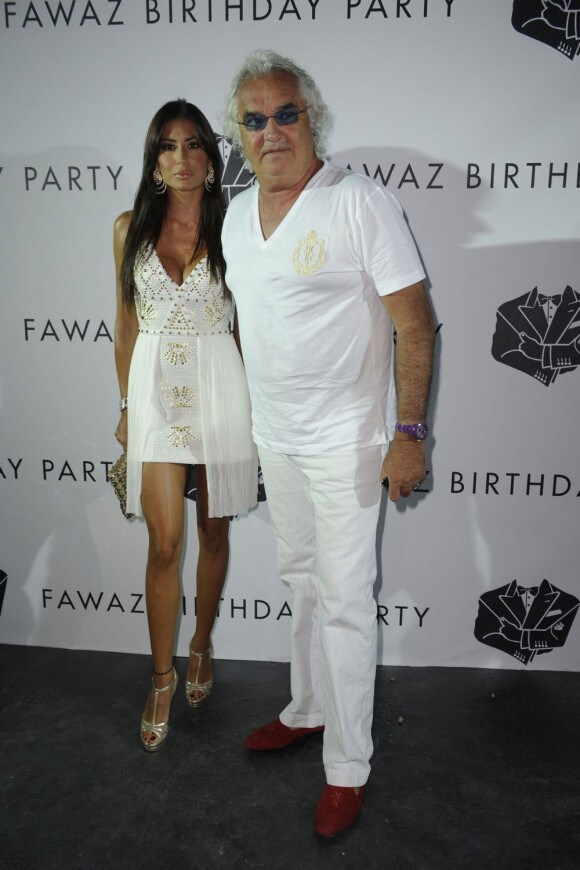 Elisabetta Gregoraci et son mari Flavio Briatore assistent à la soirée "I'm sexy and I know it" de leur ami Fawaz Gruosi qui fête ses soixante ans. Porto Cervo, le 8 août 2012.