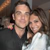 Robbie Williams et sa femme Ayda Field en février 2011 à Londres. En août 2012, le couple attend son première enfant, une petite fille.