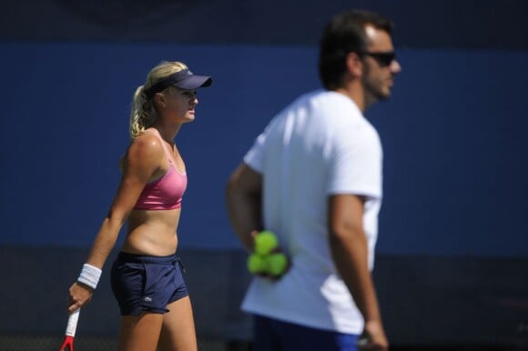 Kristina Mladenovic et son coach Thierry Ascione à l'USTA Billie Jean King National Tennis Center à New York City le 30 août 2012