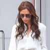 Victoria Beckham, habillée en Victoria Beckham et escarpins Manolo Blahnik, quitte la boutique Balenciaga. New York, le 11 septembre 2012.