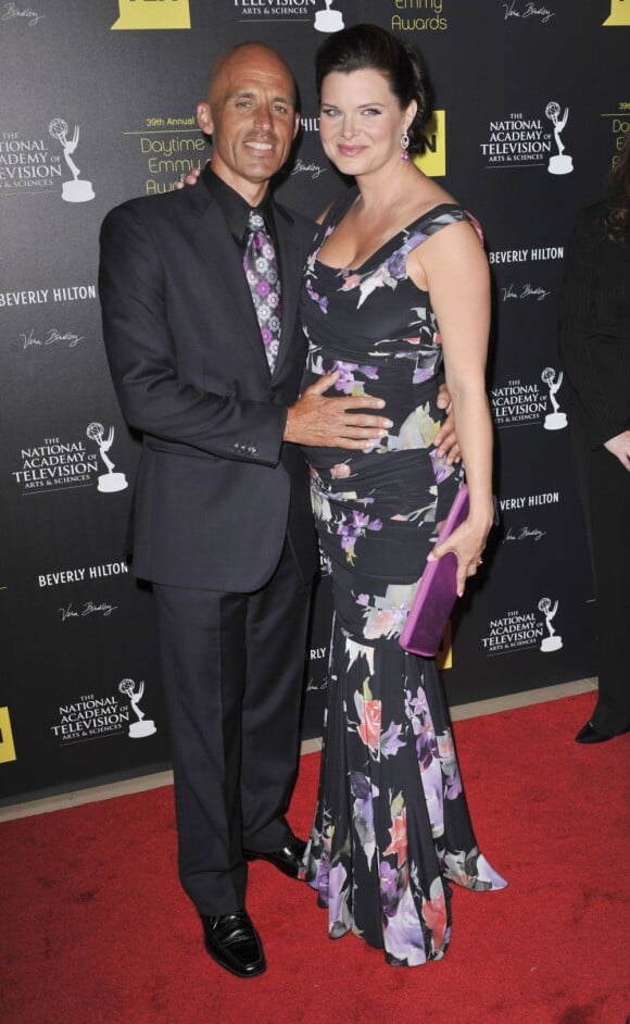 Heather Tom enceinte avec son mari James Achor en juin 2012 lors des Emmy Awards, où elle a été primée pour le Meilleur rôle dans une série dramatique grâce à son rôle de Katie Logan dans Amour, gloire et beauté. Elle était enceinte de Zane, son premier enfant, qui naîtra le 28 octobre.