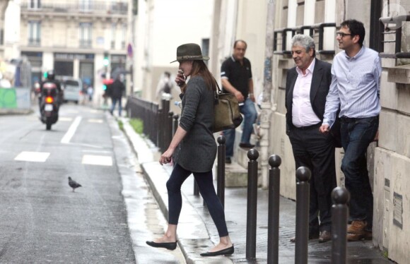 Carla Bruni-Sarkozy et Enrico Macias quittent le studio Badabing où ils viennent d'enregistrer, à Paris, le 12 juillet 2012.