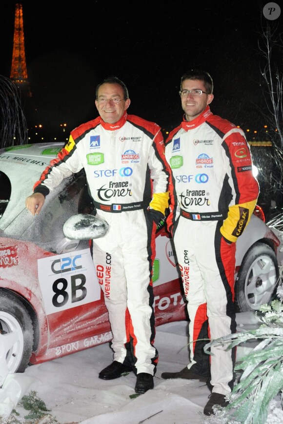 La star du JT Jean-Pierre Pernaut et son fils Olivier Pernaut présentent leur voiture pour le trophée Andros, sur le pont de l'Alma à Paris, le 4 Decembre 2012.