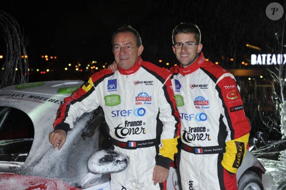 Jean-Pierre Pernaut et son fils Olivier présentent leur voiture pour le trophée Andros, sur le pont de l'Alma à Paris, le 4 Decembre 2012.