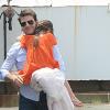 Tom Cruise s'apprête à prendre l'hélicoptère avec sa fille Suri, le 18 juillet 2012.