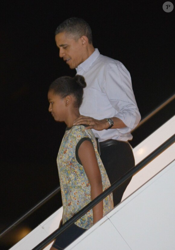 Barack Obama et sa fille Sasha arrivent à Honolulu. Le 22 décembre 2012.