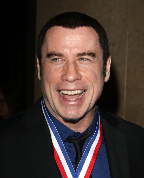 John Travolta tout sourire à la 10e cérémonie annuelle Living Legends of Aviation Awards à Beverly Hills, le 18 janvier 2013.