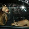 Rihanna, sexy et sensuelle, quitte le Playhouse, une boîte de nuit de Los Angeles, au bras de son amie Melissa, le 24 janvier 2013. Rihanna arbore une robe très courte noire transparente sans soutien-gorge sur de somptueux talons.