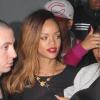 Rihanna, souriante et épanouie, quitte le Playhouse, une boîte de nuit de Los Angeles, au bras de son amie Melissa, le 24 janvier 2013. Rihanna arbore une robe très courte noire transparente sans soutien-gorge sur de somptueux talons.