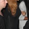 La superbe Rihanna quitte le Playhouse, une boîte de nuit de Los Angeles, au bras de son amie Melissa, le 24 janvier 2013. Rihanna arbore une robe très courte noire transparente sans soutien-gorge sur de somptueux talons.