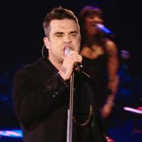 Robbie Williams overbooké : Clip, tournée solo et retrouvailles avec Take That