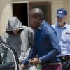 Oscar Pistorius quittant le commissariat de Boschkop à Pretoria le 14 février 2013