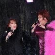 Le double travesti de Régine et Régine à la soirée Regine's Birthday chez Michou à Paris, le 12 février 2013.