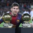 Lionel Messi et ses quatre Ballon d'or présentés au Camp Nou de Barcelone le 16 janvier 2013