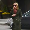 Nicky Hilton quitte son hôtel à New York, habillée d'un caban kaki, d'un pantalon en cuir et de bottines Chloé avec une écharpe Louis Vuitton et un sac Goyard. Le 21 mars 2013.