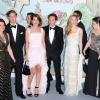 Charlotte Casiraghi et Gad Elmaleh posent avec Pierre Casiraghi et Beatrice Borromeo lors du Bal de la Rose, le 23 mars 2013, au Sporting de Monte-Carlo. En l'honneur du 150e anniversaire de la Société des Bains de mer, Karl Lagerfeld avait été mandaté par son amie la princesse Caroline pour imaginer une soirée exceptionnelle : Belle et Pop, une traversée du temps de la Belle Epoque à l'ère pop.