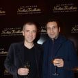 Bruno Putzulu et Zinedine Soualem à la soirée Nicolas Feuillatte, célèbre maison de champagne, aux Salons France Amériques à Paris, mercredi 10 avril 2013.