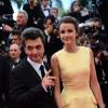 Thomas Langmann et Céline Bosquet à la montée des marches du film Inside Llewyn Davis lors du 66e festival du film de Cannes, le 19 mai 2013.