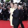 Thomas Langmann et Céline Bosquet, tout sourire pendant la montée des marches du film Inside Llewyn Davis lors du 66e festival du film de Cannes, le 19 mai 2013.
