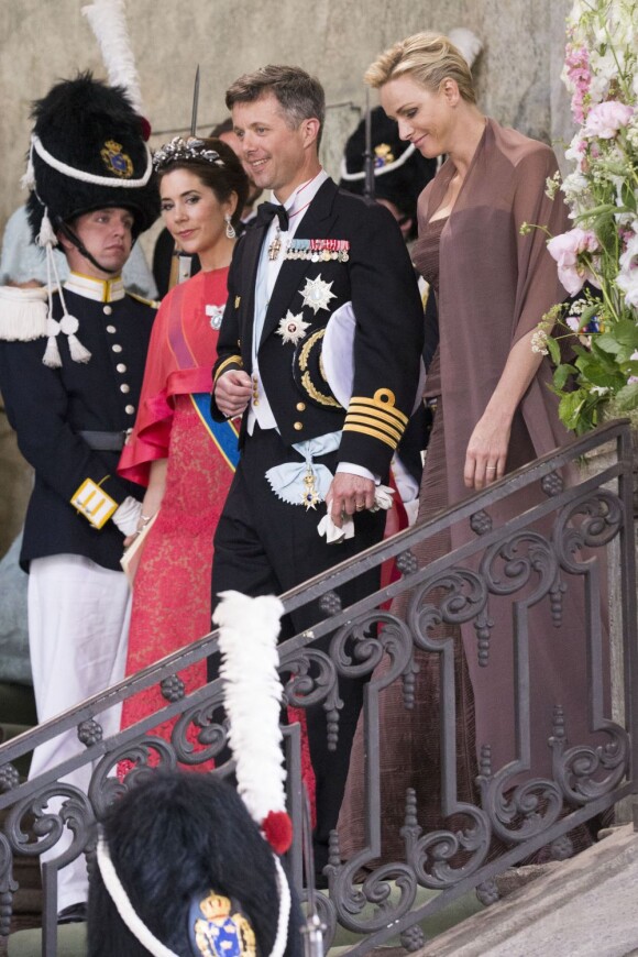 La princesse Charlene de Monaco avec Frederik et Mary de Danemark au mariage de la princesse Madeleine de Suède et de Chris O'Neill le 8 juin 2013 au palais royal à Stockholm.