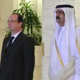 François Hollande et l'émir du Qatar Hamad Ben Khalifa Al Thani à Doha le 23 juin 2013.