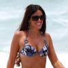 La bombe italienne Claudia Romani se détend sur une plage de Miami. Le 23 juin 2013.