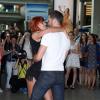 Emmanuel Moire et la danseuse Fauve Hautot à l'aéroport de Roissy-Charles-de-Gaulle, le 12 juillet 2013.