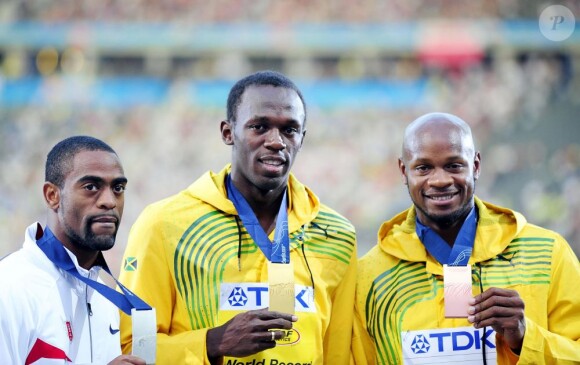 Usain Bolt entouré de Tyson Gay et Asafa Powell lors des championnats du monde de Berlin le 17 août 2009