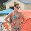 Doutzen Kroes, son mari Sunnery James, et leur fils Phyllon en vacances sur la plage a Miami, le 25 mars 2013. PLEASE HIDE CHILDREN'S FACE PRIOR TO THE PUBLICATION - Doutzen Kroes shows off her bikini body as she plays with her son Phyllon at the beach in Miami, Florida on March 25, 2013. Doutzen shared a kiss with her husband Sunnery before the pair played ball on the beach with their son and another boy...25/03/2013 - Miami