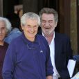 Claude Lelouch et Eddy Mitchell rieurs pendant le dernier jour de tournage du film "Salaud, on t'aime" à Saint-Gervais-les-Bains, le 31 juillet 2013.