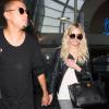 Ashlee Simpson et son petit ami Evan Ross arrivent à l'aéroport de Los Angeles, le 31 juillet 2013.