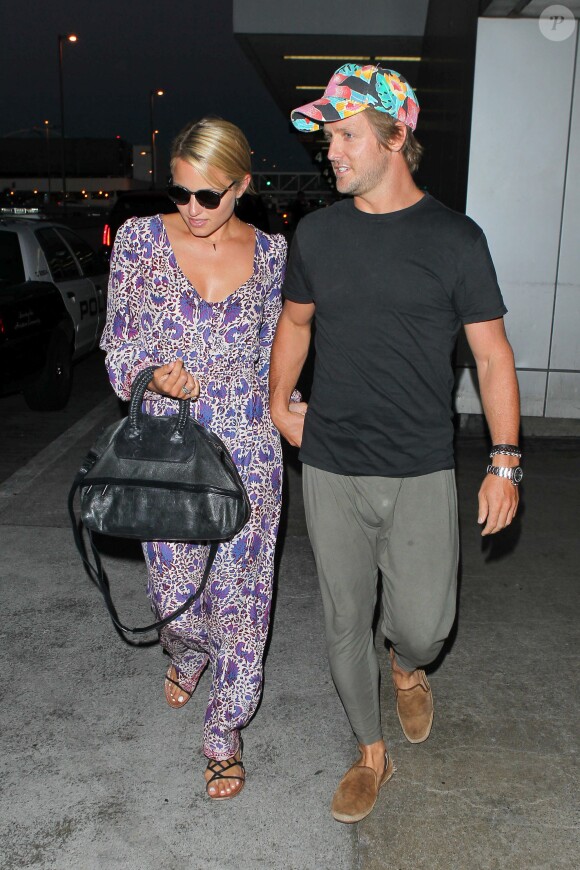 Dianna Agron et son compagnon Nick Mathers à l'aéroport de Los Angeles, le 3 septembre 2013. Ils arrivent de New York.