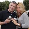 Jean-Marie Bigard et sa femme Lola - Tournoi de pétanque organisé place des Invalides à Paris et dont les fonds ont été reversés à l'association Meghanora, seule association en Europe à aider la recherche concernant les tumeurs rénales de l'enfant. Le 29 septembre 2013.