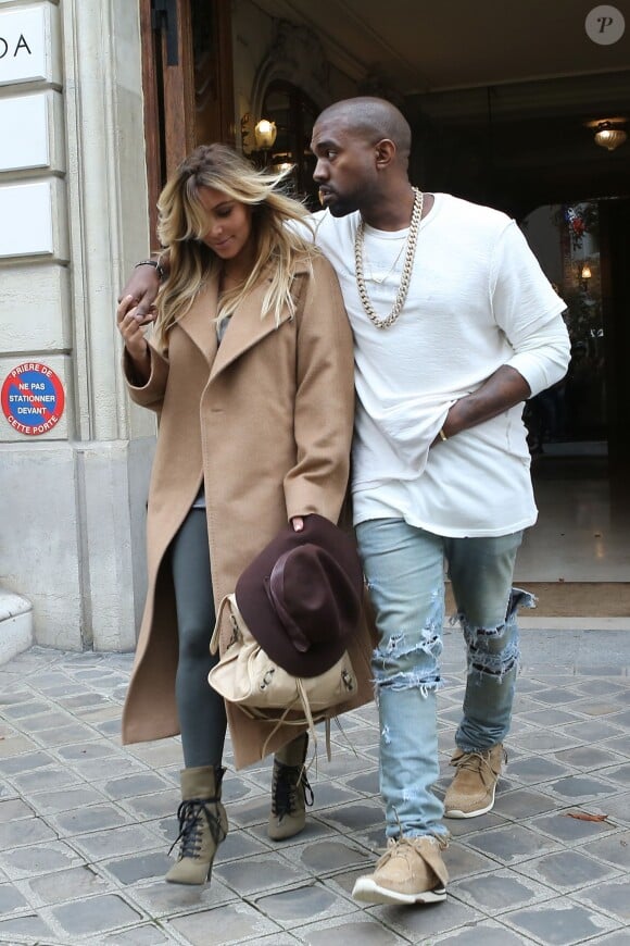 Kim Kardashian et Kanye West quittent l'atelier Givenchy à Paris. Le 28 septembre 2013.