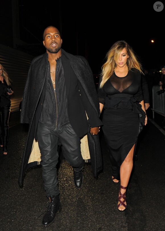 Kanye West et Kim Kardashian arrivent à la Halle Freyssinet pour assister au défilé Givenchy prêt-à-porter printemps-été 2014. Paris, le 29 septembre 2013.