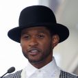 Usher assiste à l'inauguration de l'étoile de Kenny 'Babyface' Edmonds sur le Hollywood Walk of Fame, à Los Angeles le 10 octobre 2013.