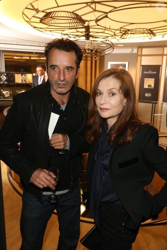 Bruno Todeschini et Isabelle Huppert à la soirée Jaeger-LeCoultre organisée à Paris Place Vendôme pour le premier anniversaire de la nouvelle boutique de la maison. Le 17 octobre 2013