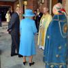 La reine Elizabeth II et le duc d'Edimbourg accueillis par l'archevêque de Canterbury et l'évêque de Londres au baptême du prince George de Cambridge, 3 mois, le 23 octobre 2013 au palais Saint James, à Londres.