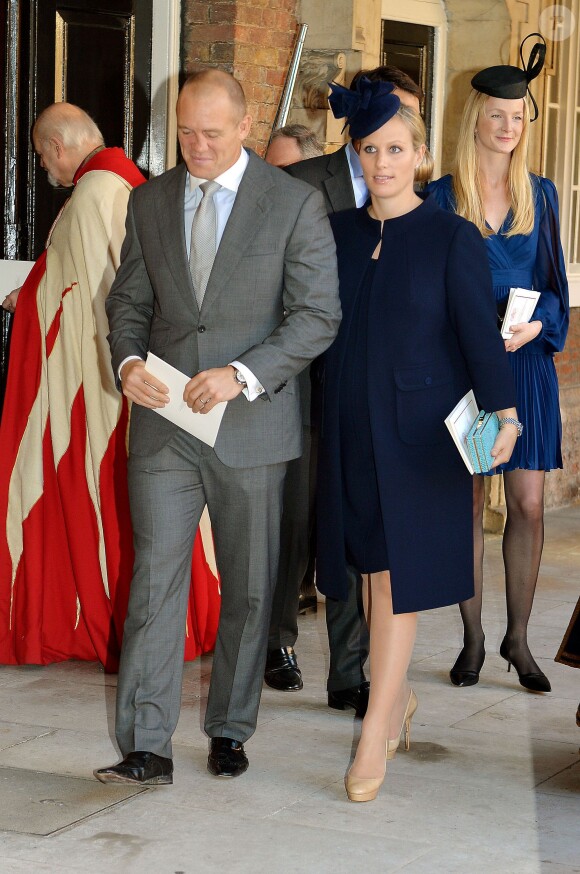 Zara Phillips-Tindall et son mari Mike Tindall quittant la chapelle royale après le baptême du prince George de Cambridge, 3 mois, le 23 octobre 2013 au palais Saint James, à Londres.