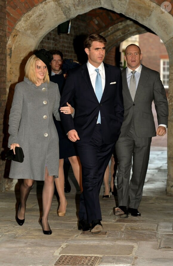 Oliver Baker, ami de fac du duc et de la duchesse de Cambridge, qui l'ont choisi pour parrain de leur fils, et sa compagne Mel au baptême du prince George de Cambridge, 3 mois, le 23 octobre 2013 au palais Saint James, à Londres.